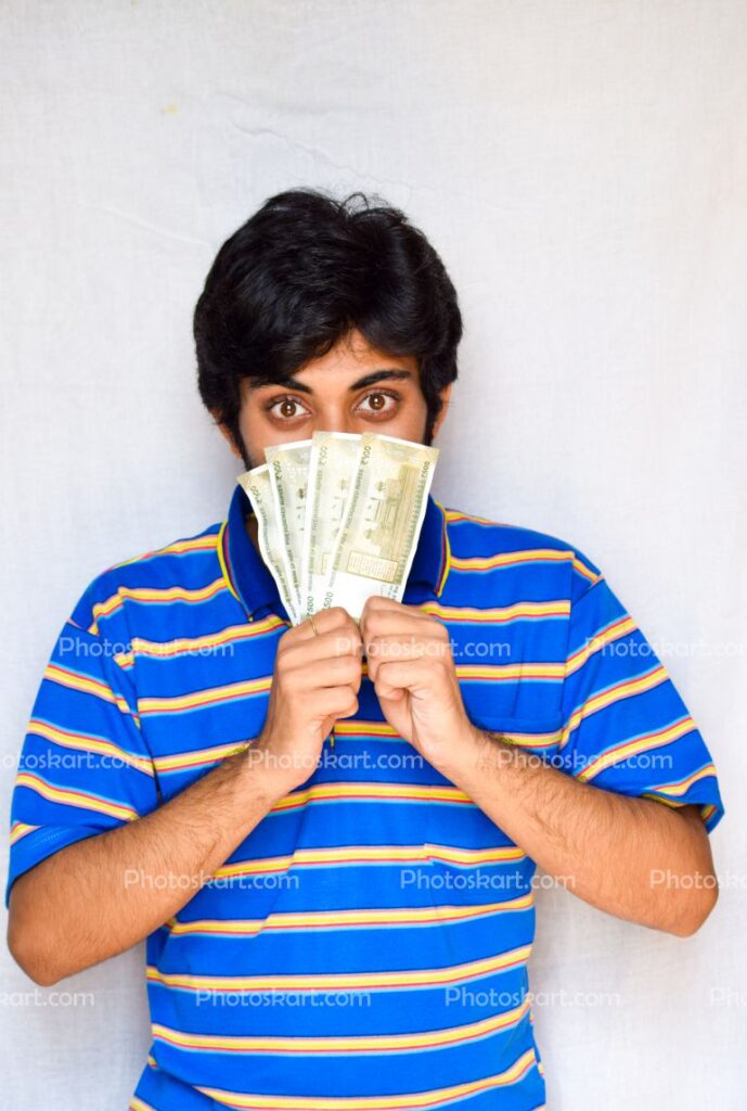 Confused Young Boy Covered His Face With Money