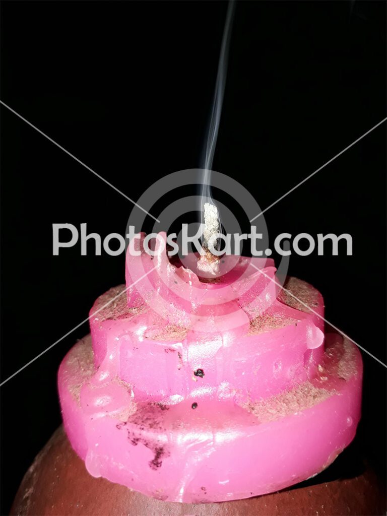 Pink Lit Candle Stock Image