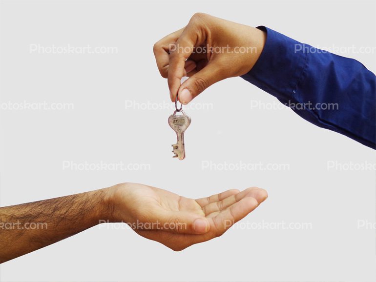 Man Hand Giving Keys To Another Man