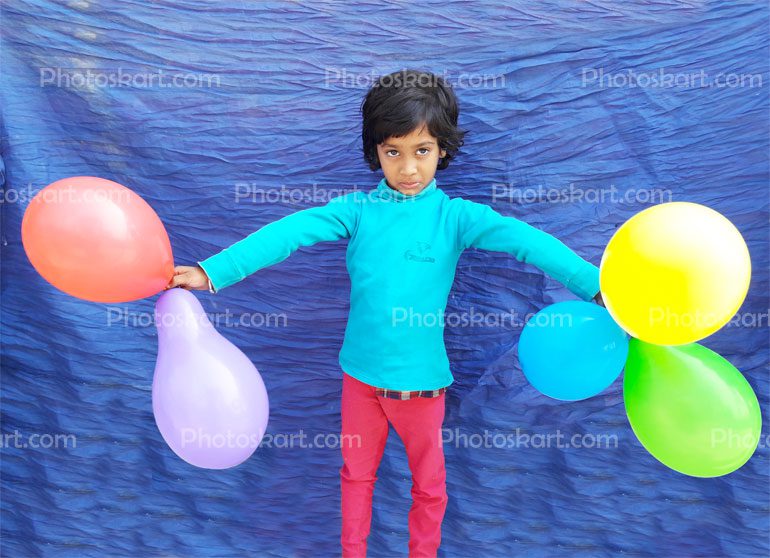 A Girl With Blue Top Have Ballons