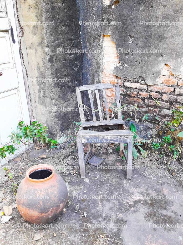 A Old Chire And Old Water Pot