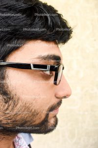 smart-happy-boy-side-facing-stock-photo