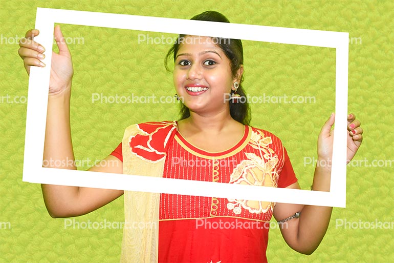 Young Indian Lady Holding A Photo Frame