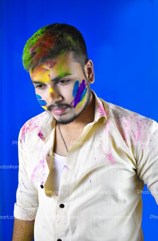 A Boy Pose With Holi Color