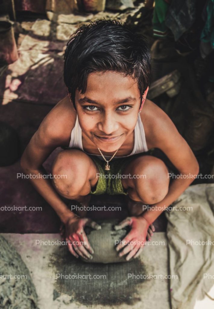 A Indian Boy Play In Clay