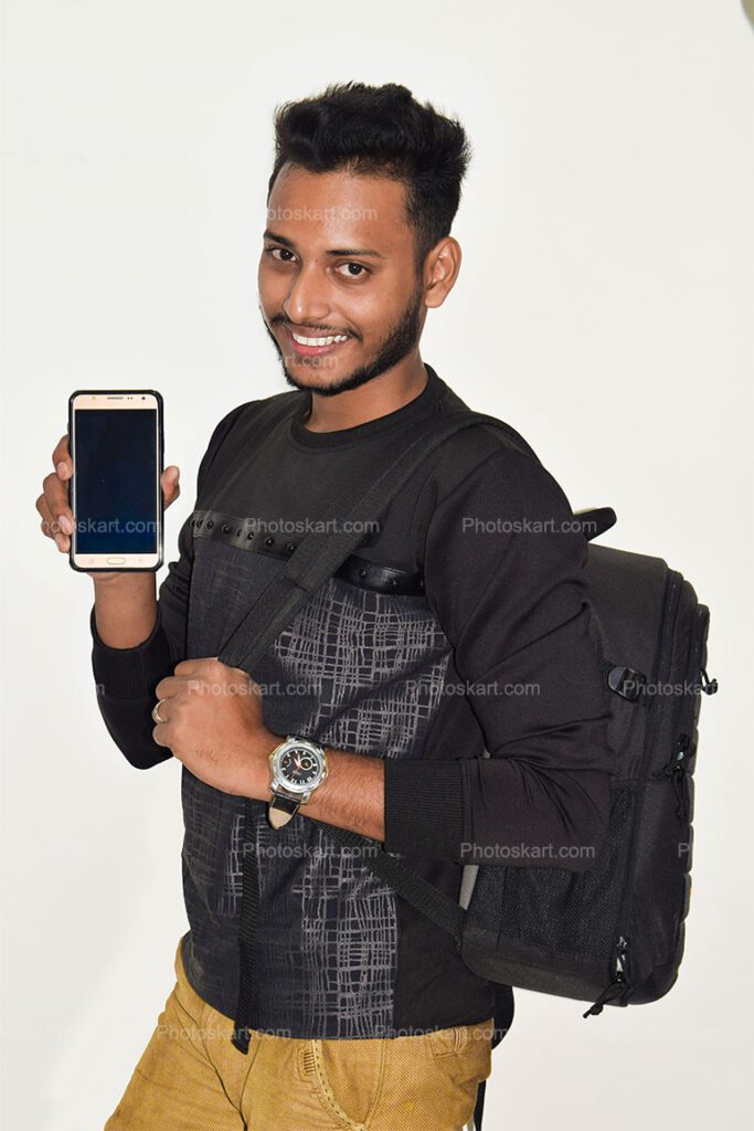 A Indian College Student Showing A Smartphone With Bag