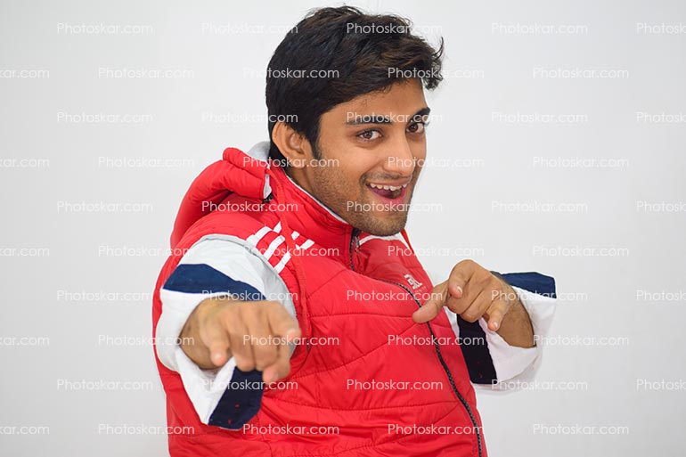 Dancing Pose Indian Smart Boy With Red Half Pullover