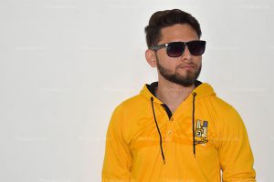 a-indian-styling-boy-wear-yellow-hood-jacket-with-black-sunglass