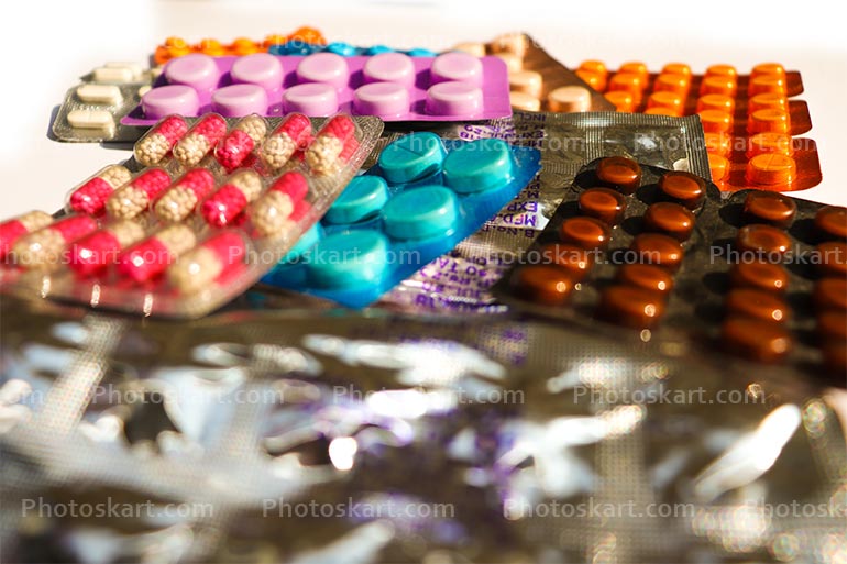 Many Different Colorful Pills In Strips