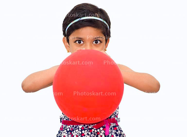 A Child Girl Blow The Balloon
