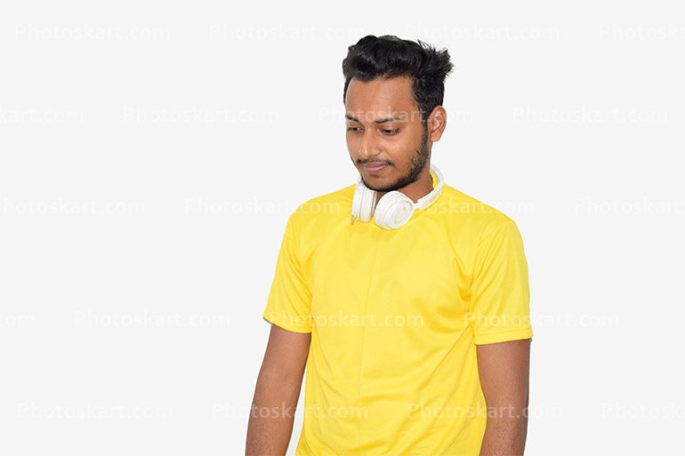 A Young Boy Standing Wear A Yellow T Shirt