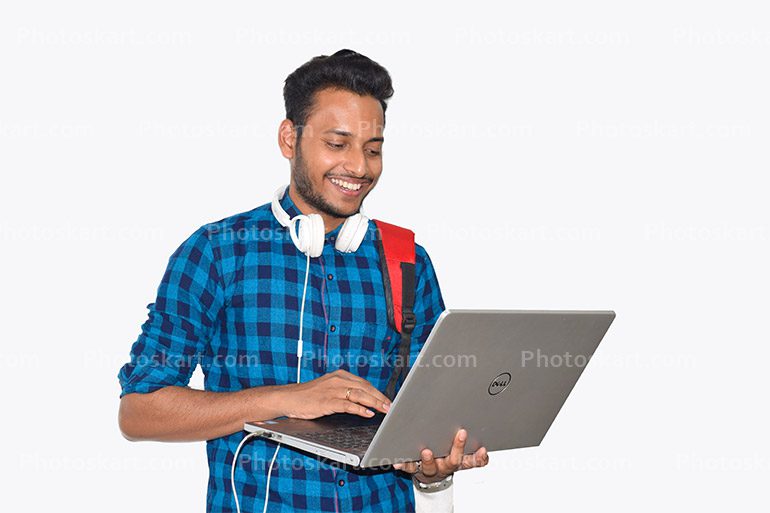 A Young Boy Wear A White Headphone And Working His Laptop