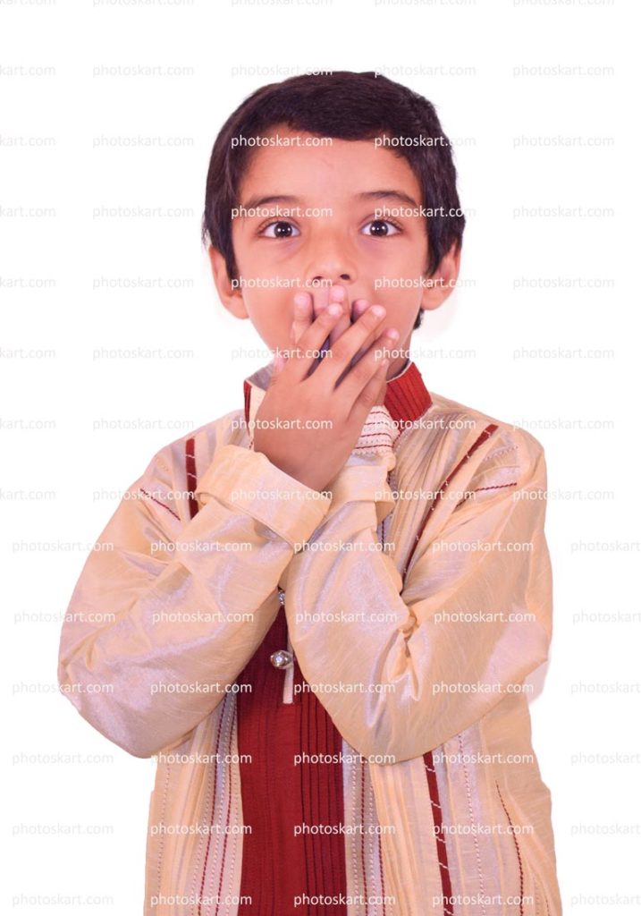 An Indian Little Boy Covering His Mouth With Hand