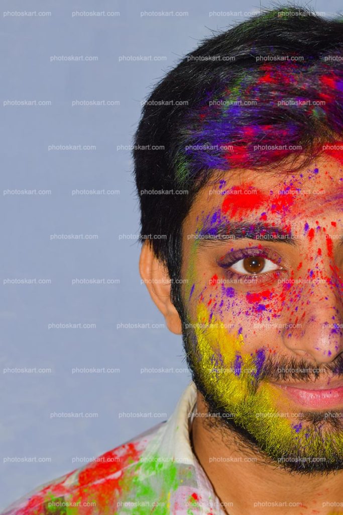 Side Face Of Young Boy With Colors During Holi