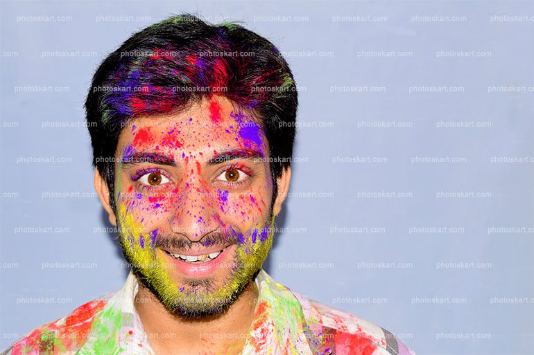 Portrait Of Smiling Man On Holi Color Festival