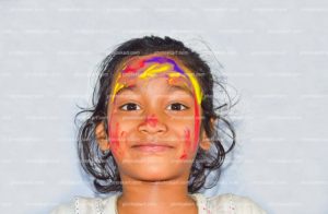 a-little-girl-smiling-at-holi-festival-stock-photos