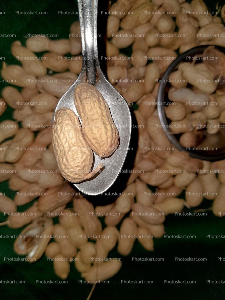 Peanuts In Spoon Close Up Stock Photos