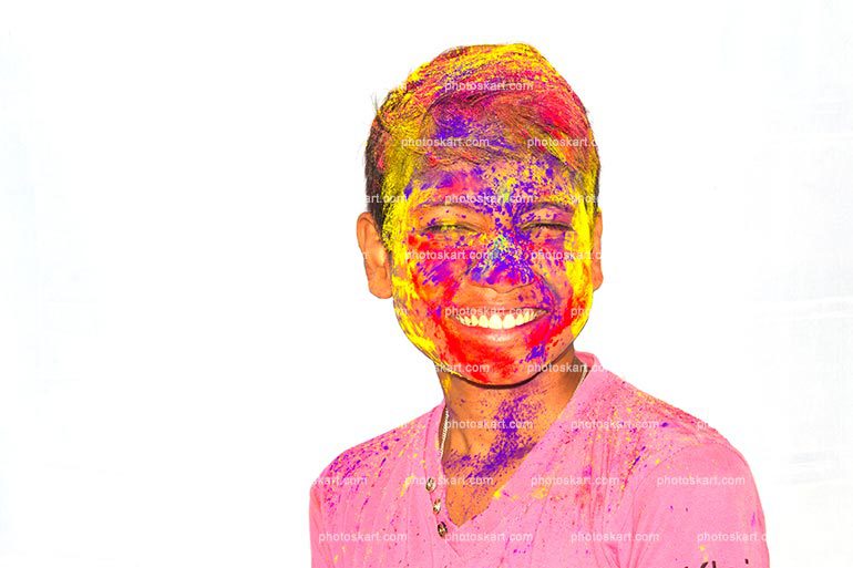 Indian Boy With Colored Face Celebrating Holi Color Festival