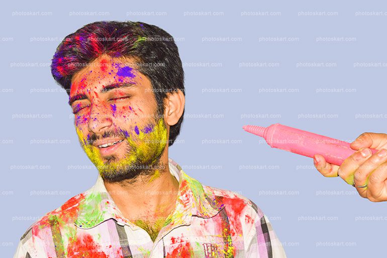 Young Man With Closed Eyes Near Splashing Colours On Holi With Pichkari