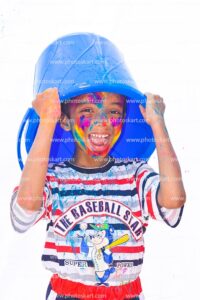 a-boy-cover-his-head-with-balti-during-holi