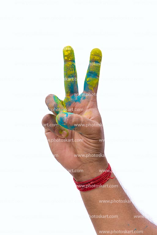 A Holi Colourful Hand Showing The Victory Sign Stock Images In White Background