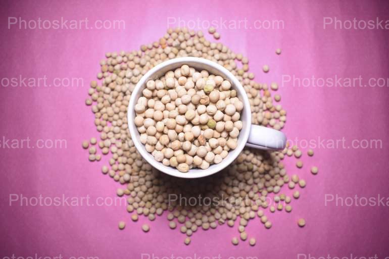 A Full Mug Of Matar With Violet Background