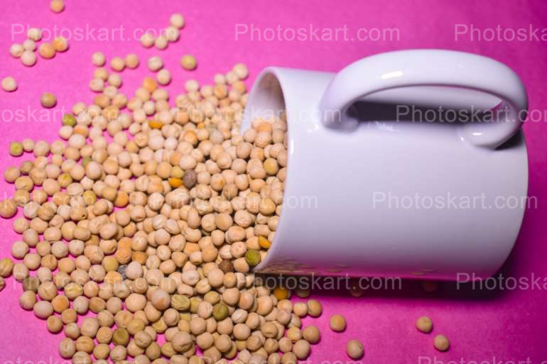 Matar Dal Falling From A White Mug