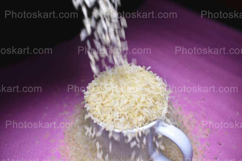 Rice Falling In A Mug