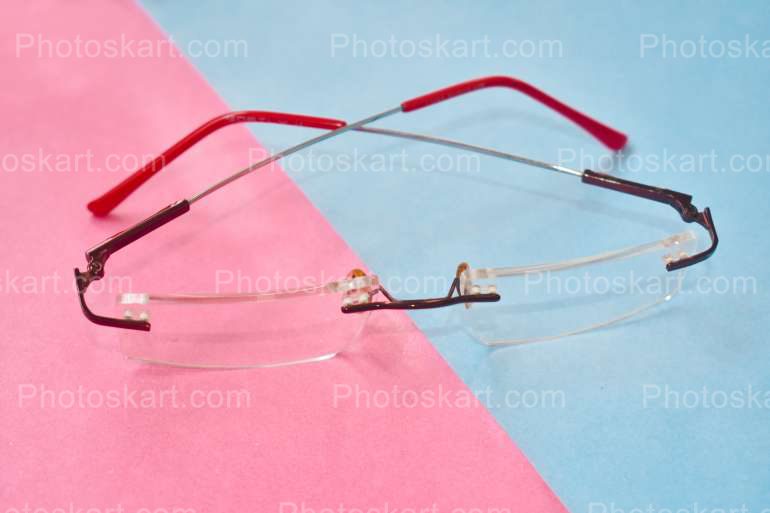 Rimless Spectacle With Pink And Sky Background