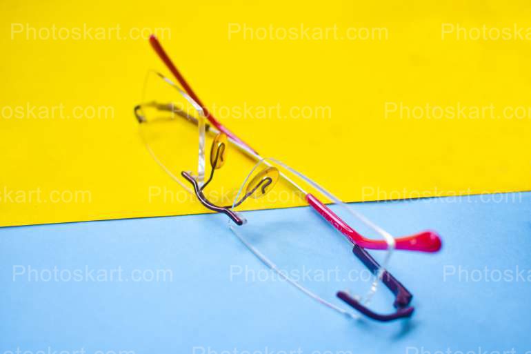 Spectacle With Yellow And Sky Background