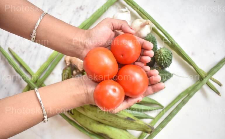 Tomato Holding On Hands
