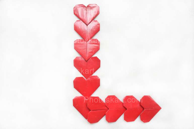 Forming L With Little Heart Stock Image