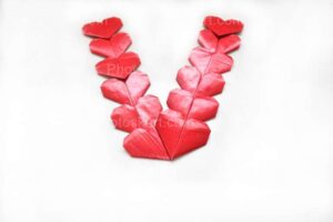v-shape-forming-using-red-little-heart-free-stock-image