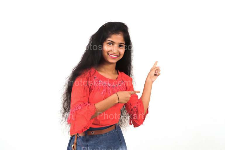 Smiling Indian Girl Pointing Finger To A Space