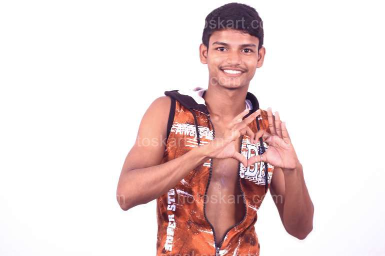 Young Indian Boy Showing Heart Symbol