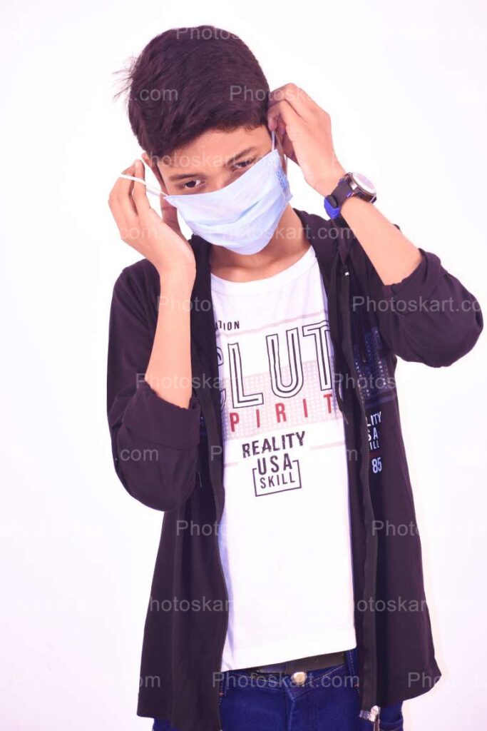 Young Indian Boy Wearing Mask Stock Photo