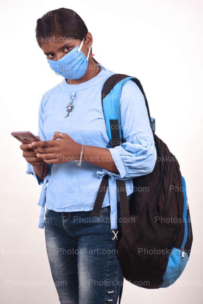 Young Indian School Girl Using Mobile