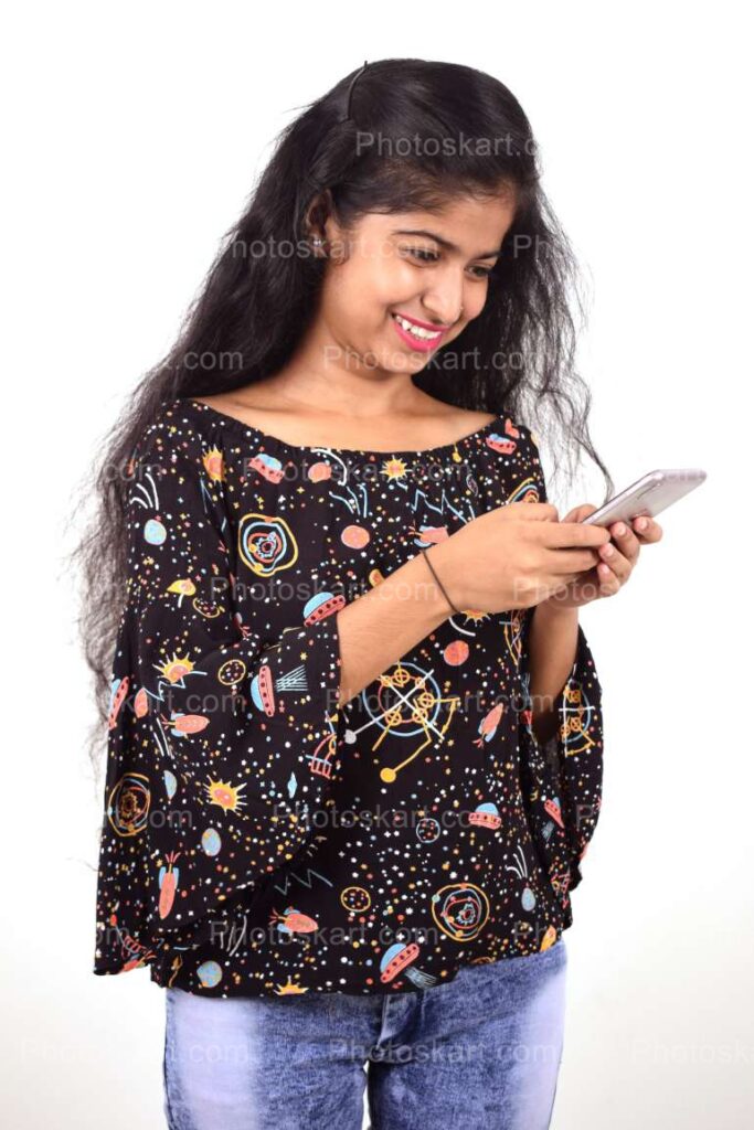 a bengali girl showing funny contain in mobile phone stock image |  Photoskart