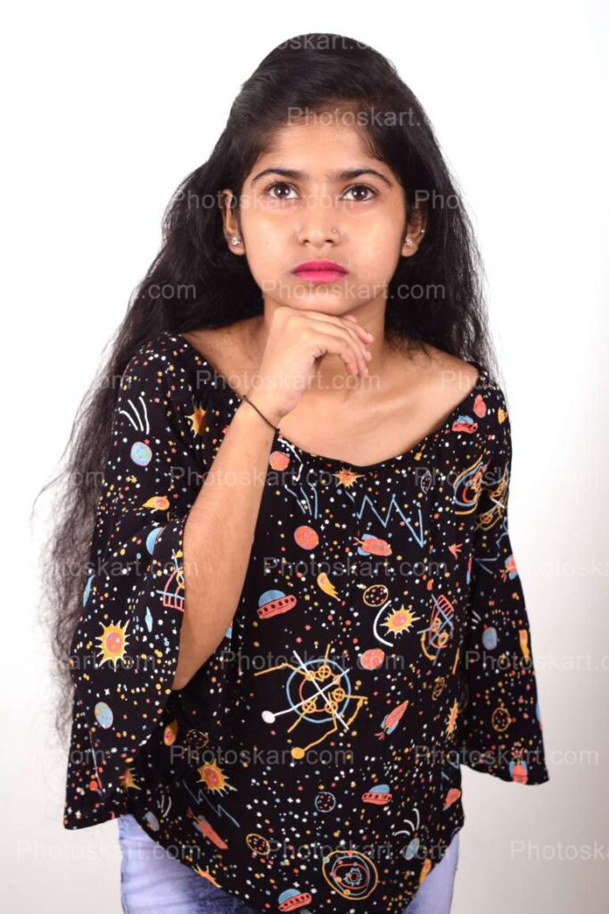 A Courious Indian Girl With Black Top Stock Photo