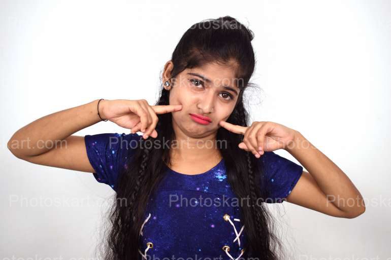 a cute indian bengali girl making funny face | Photoskart