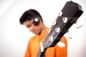 a-cute-indian-boy-with-guiter-stock-image-photography