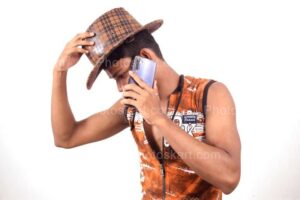 indian-boy-talking-with-someone-wears-cowboy-hat
