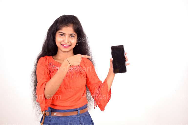 A Young Indian Girl Indicating A Mobile Phone