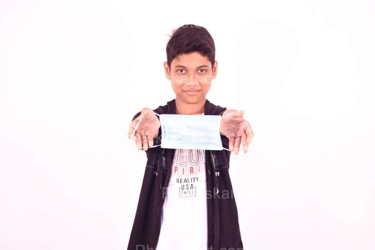 An Indian Boy Showing Mask Stock Image