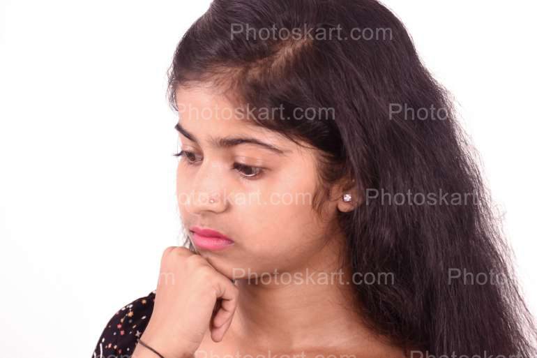 An Indian Girl Thinking Some Serious Matter Stock Image