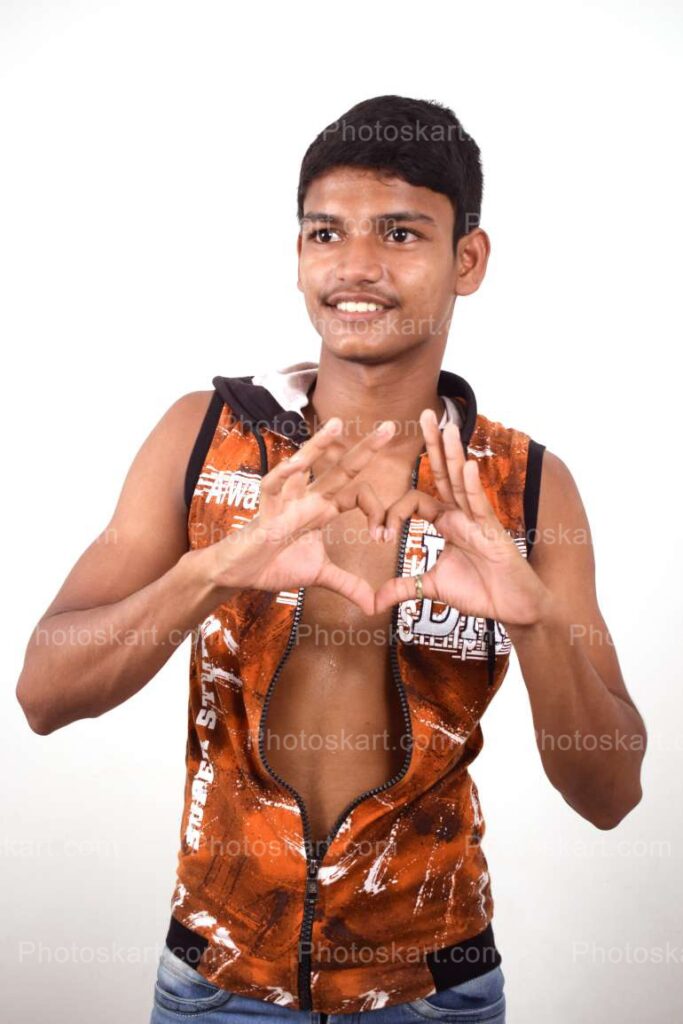 An Indian Boy Making Heart Gesture With Fingers
