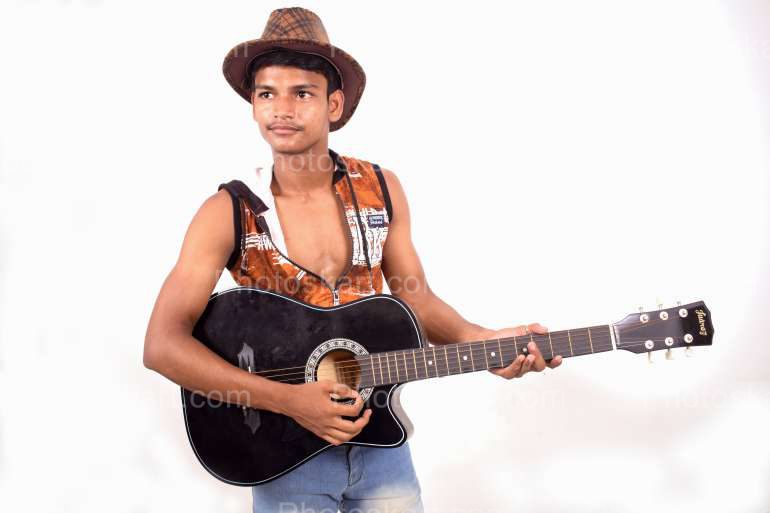 An Indian Boy Wearing Cow Boy Hat Holding Guiter Royalty Free Image