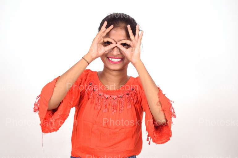 An Indian Girl Making Hand Gesture On Her Face