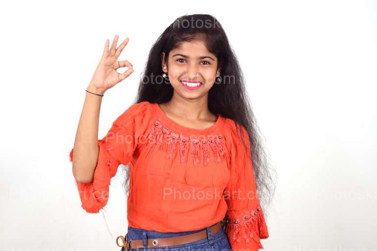 An Indian Girl Showing Ok Gesture With Her Fingers