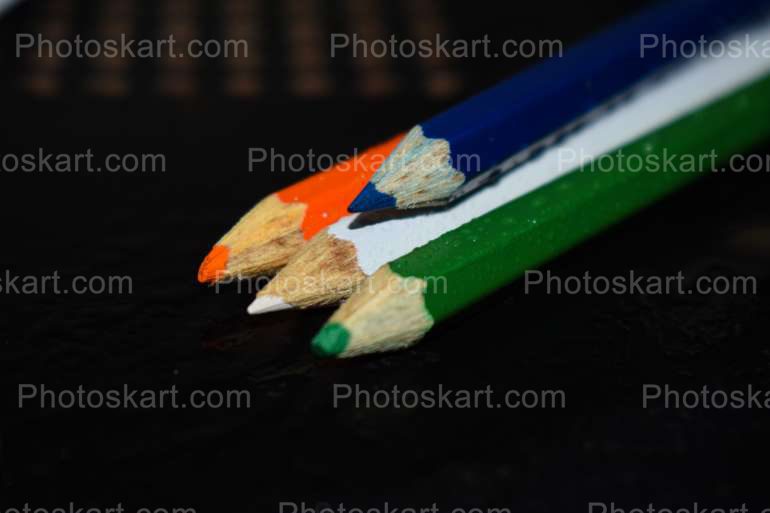 4 Color Pencils With Black Background Stock Photo